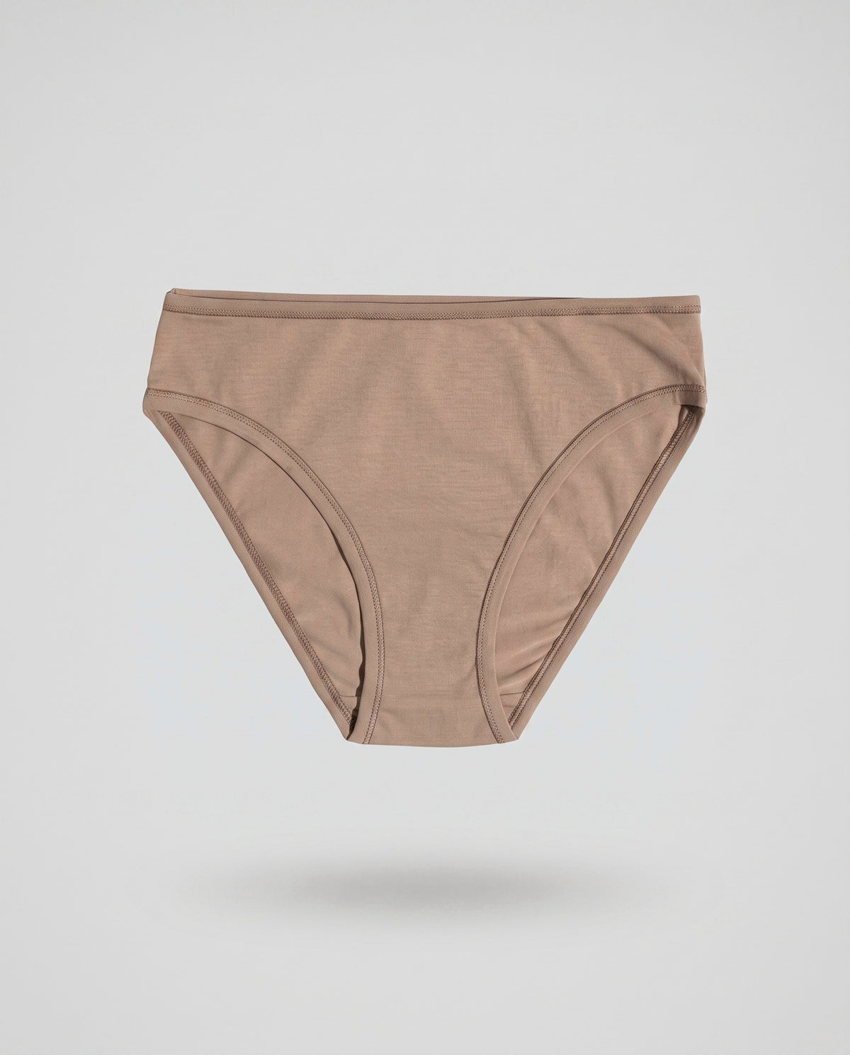 A KAYA mocha plain cotton bikini brief on a pale grey backdrop