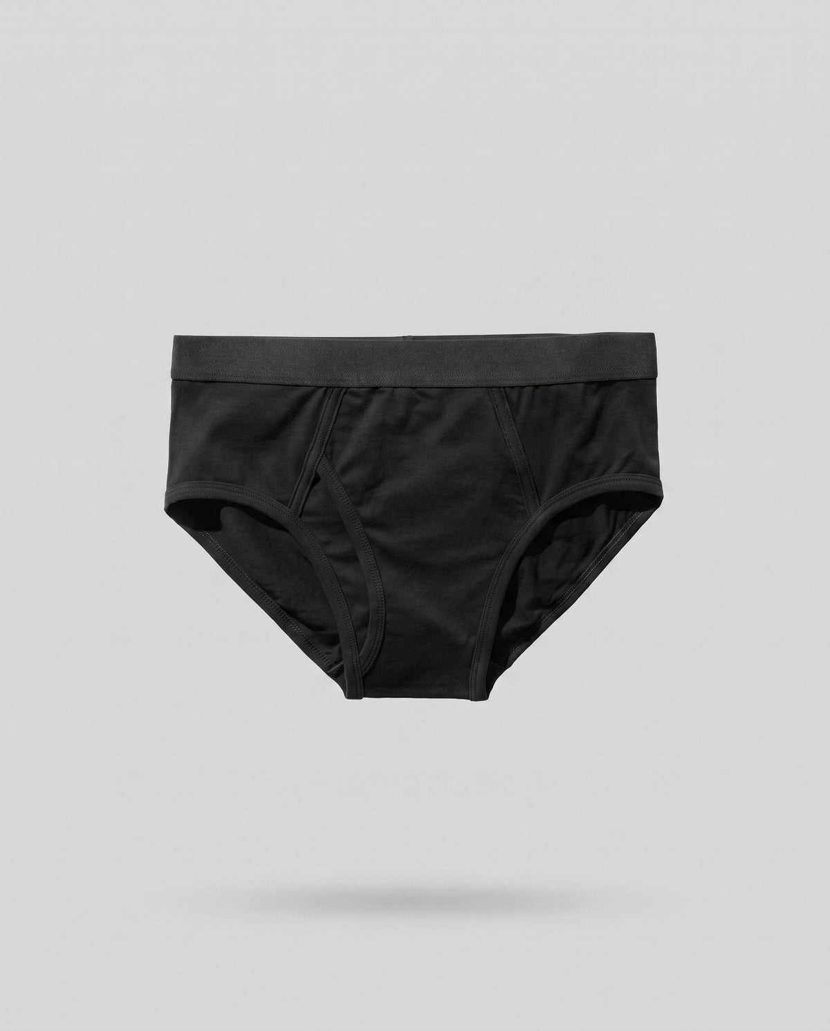 A KAYA black seamed cotton brief on a pale grey backdrop