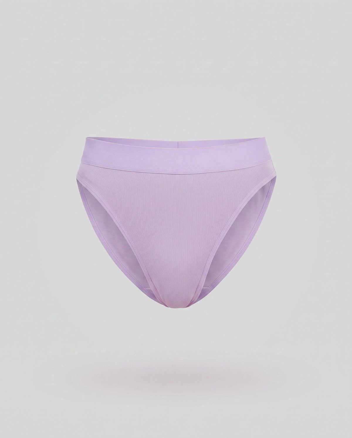 A KAYA lilac cotton thong on a pale grey backdrop