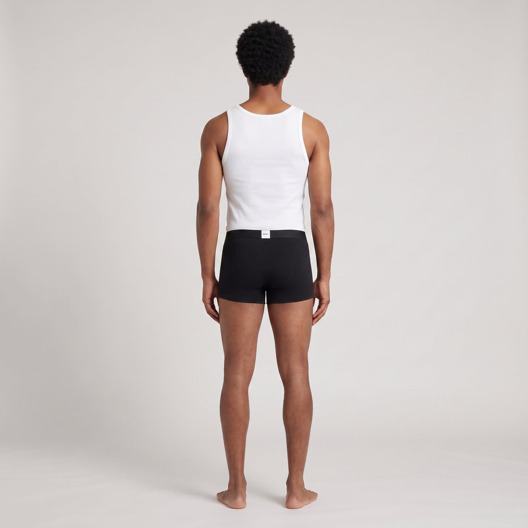 Black Printed Cotton Undershirt + 2-Pack Plain Black Trunks, worn, back view