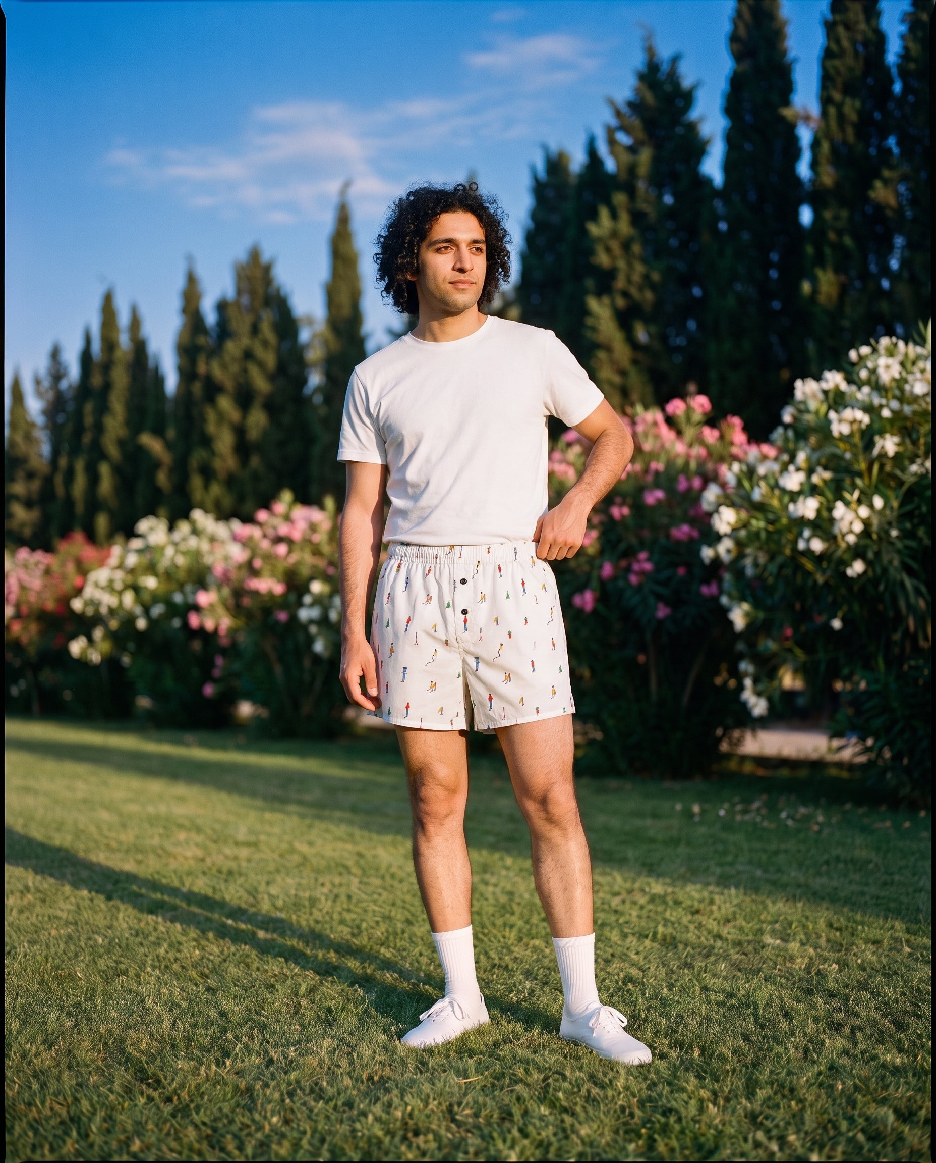 The KAYA x Mulehet cotton boxer in White, worn on a lawn at golden hour